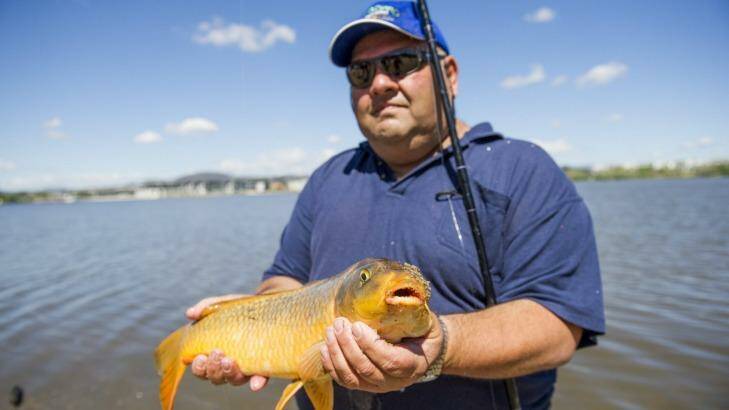 Success: Charlie Diedo catches carp from Lake Burley Griffin. Photo: Jay Cronan