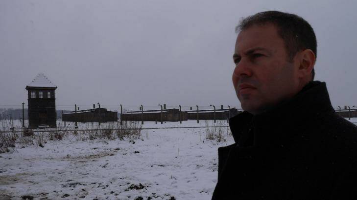 'It's chilling to think so many innocent people lost their lives here': Australia's Assistant Treasurer Josh Frydenberg looks out on the ruins of Auschwitz-Birkenau. Photo: Nick Miller