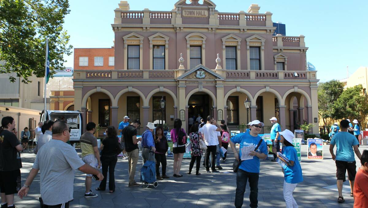 People line up to vote in the NSW State election at Parramatta Town Hall in Parramatta. Photo: Helen Nezdropa