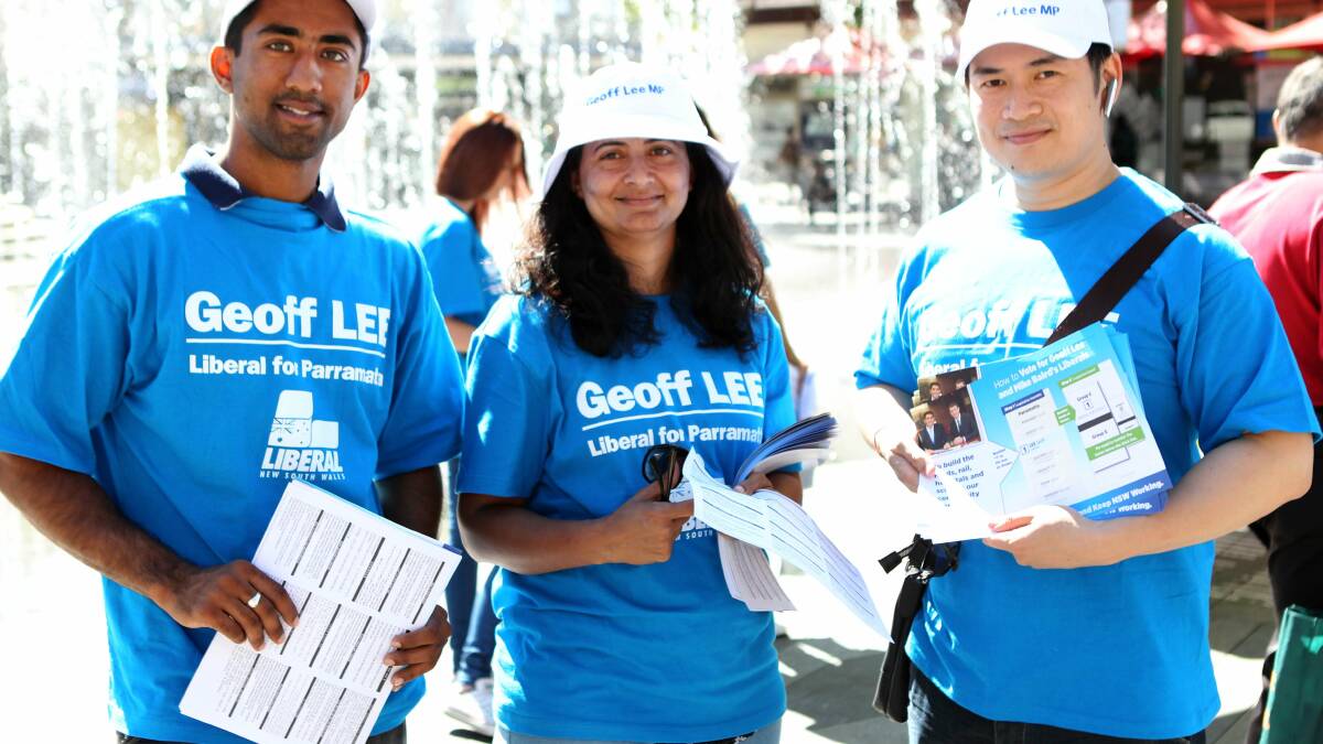 Harry Singh, Pam Jawaharwala and Anthony Lee supporting Geoff Lee at the NSW State election at Parramatta Town Hall in Parramatta. Photo: Helen Nezdropa