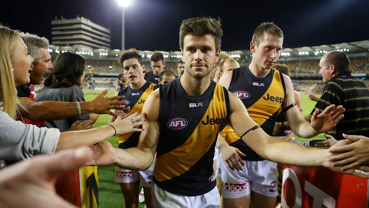 Trent Cochin of the Tigers celebrates winning the round five AFL match between the Brisbane Lions and the Richmond Tigers at The Gabba on April 17, 2014 in Brisbane, Australia. Photo: Chris Hyde/Getty Images.