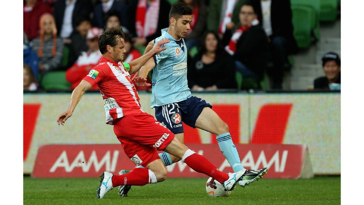 Robbie Wielaert of the Heart and Chris Naumoff of Sydney contest the ball during the round six A-League match between the Melbourne Heart and Sydney FC. Photo: Getty Images.