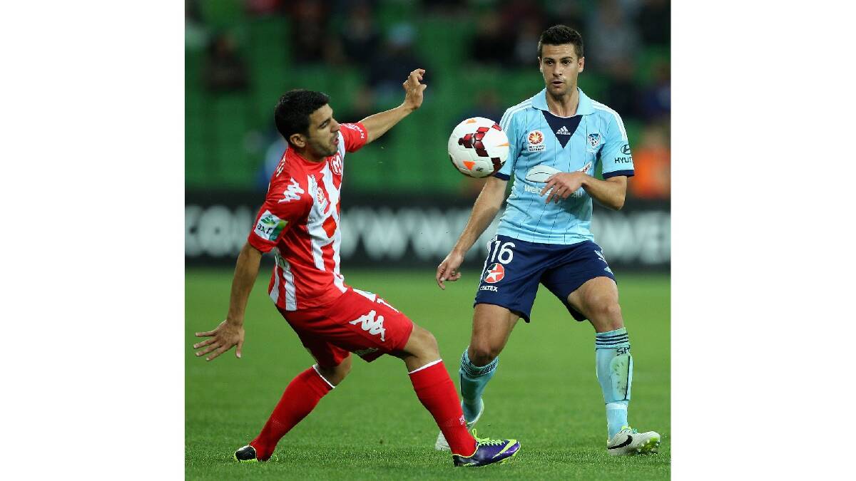 Aziz Behich of the Heart and Joel Chianese of Sydney contest the ball during the round six A-League match between the Melbourne Heart and Sydney FC. Photo: Getty Images.