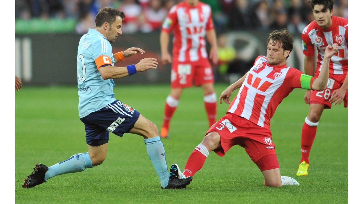 Alessandro Del Piero of Sydney is tackled by Robbie Wielaert of the Heart during the round six A-League match between the Melbourne Heart and Sydney FC. Photo: Getty Images.