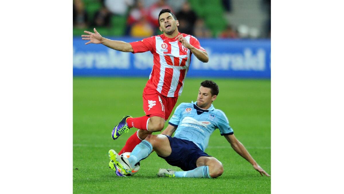 Aziz Behich of the Heart is tackled by Joel Chianese of Sydney during the round six A-League match between the Melbourne Heart and Sydney FC. Photo: Getty Images.