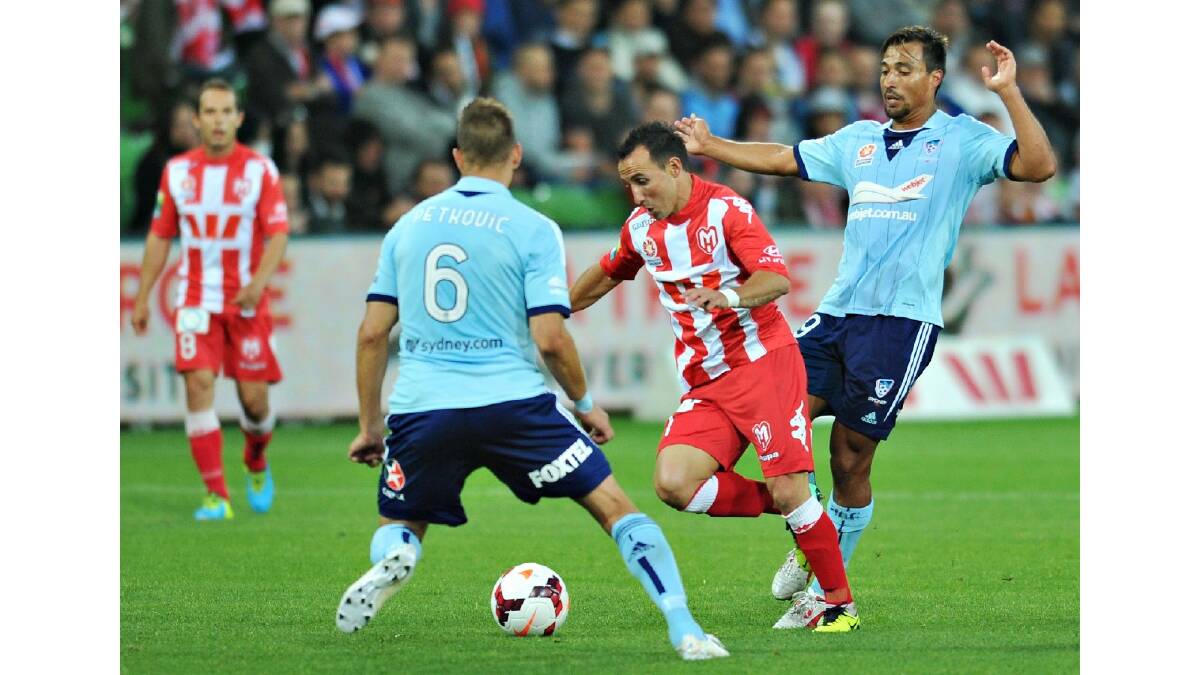 Michael Mifsud of the Heart and Nick Carle of Sydney contest for the ball during the round six A-League match between the Melbourne Heart and Sydney FC. Photo: Getty Images.